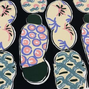 A series of bun-like shapes with abstracted pastel-colored patterns of circles, cross-hatching, and curved lines. The forms float over an opaque black background.