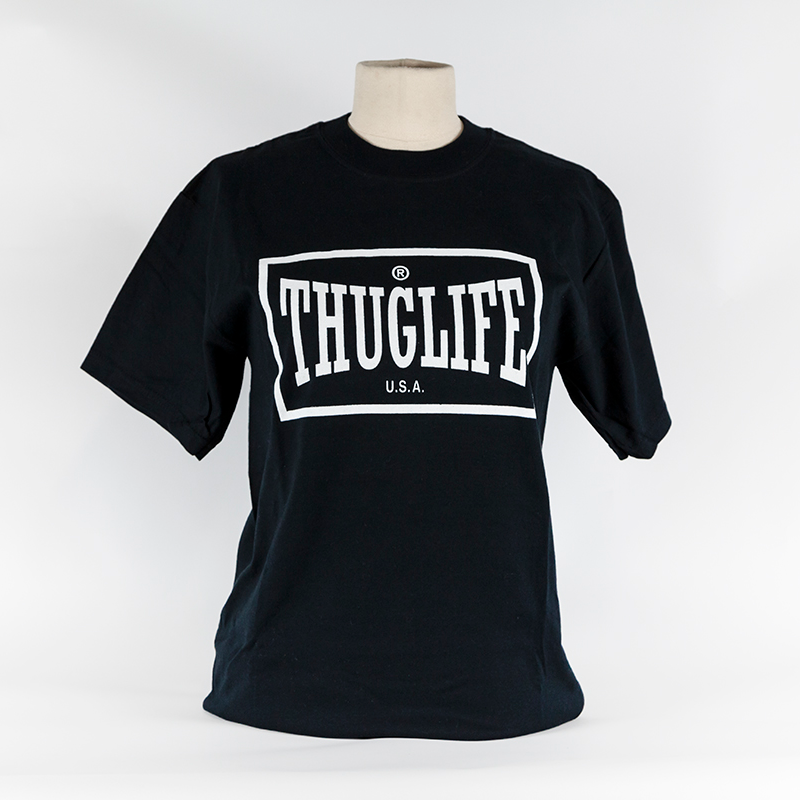 A black short-sleeve t-shirt hangs over a mannequin's bust. The white graphic on the t-shirt reads 
