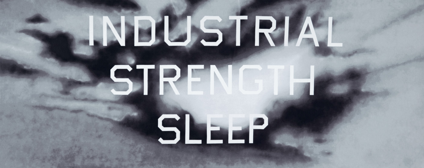 A view of Ed Ruscha’s tapestry titled “INDUSTRIAL STRENGTH SLEEP”