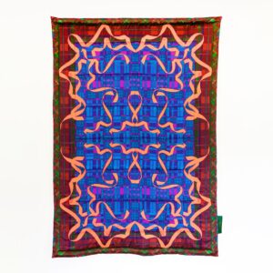 A rectangular blanket with a dark red border and deep blue center. A mirrored pattern of bright red ribbons make up the top layer of detail.