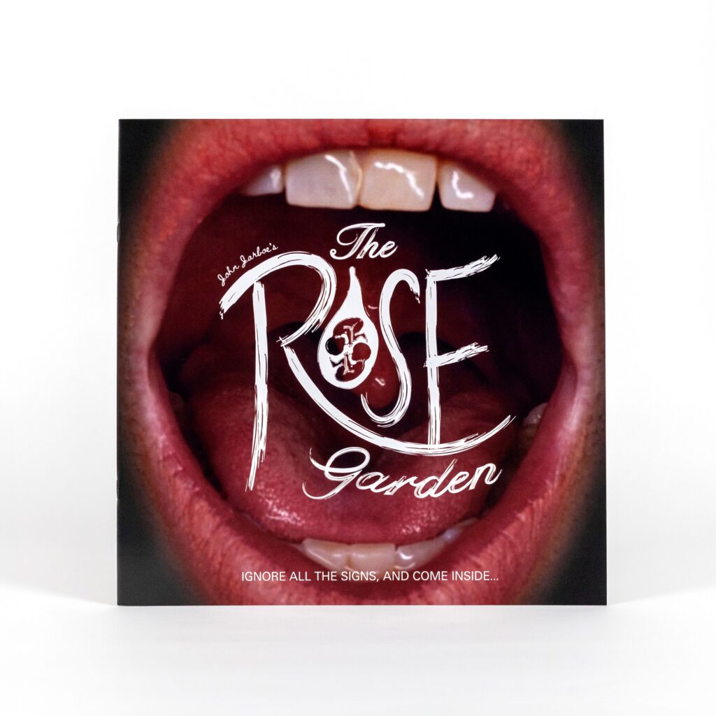 A cover of a square book. The image on the book is a close-up photo of a mouth open wide. There is text overlaying the open mouth that reads 