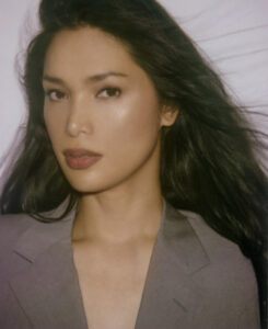 A portrait of the model and author, Geena Rocero, a Filipina woman.