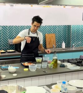 A chef preparing food in a kitchen. 