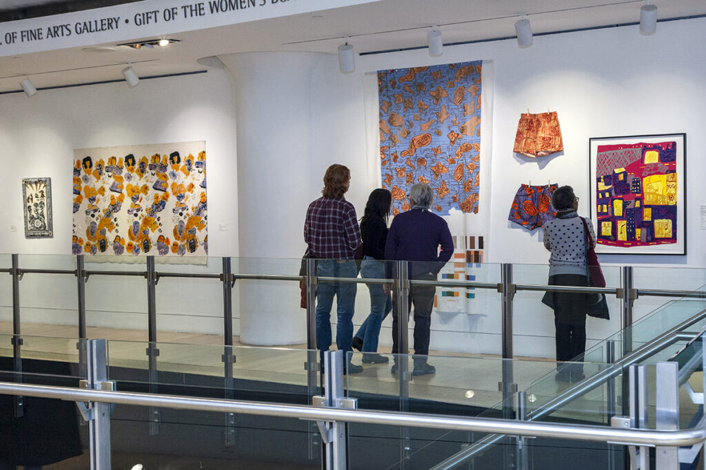 An installation view of prints on fabric on view in a gallery