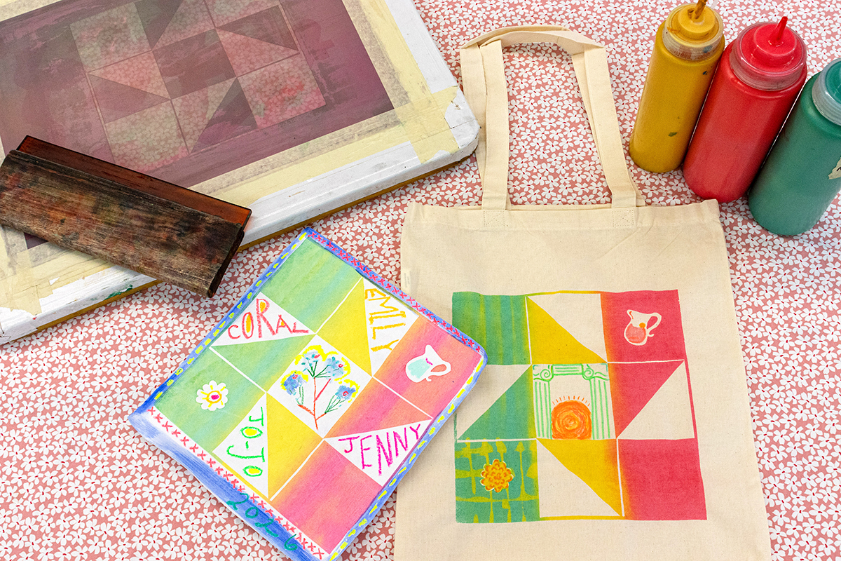A photograph of a screenprinting screen, squeegee, and ink alongside a screenprinted paper print and tote bag featuring customized geometric quilt squares.