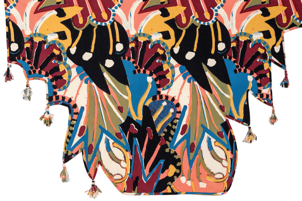 An decorative artwork with an organic shape of curves and fringe.